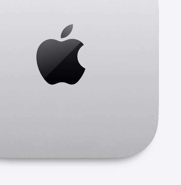 Vista desde arriba en primer plano de una Mac mini color plata con el logo de Apple