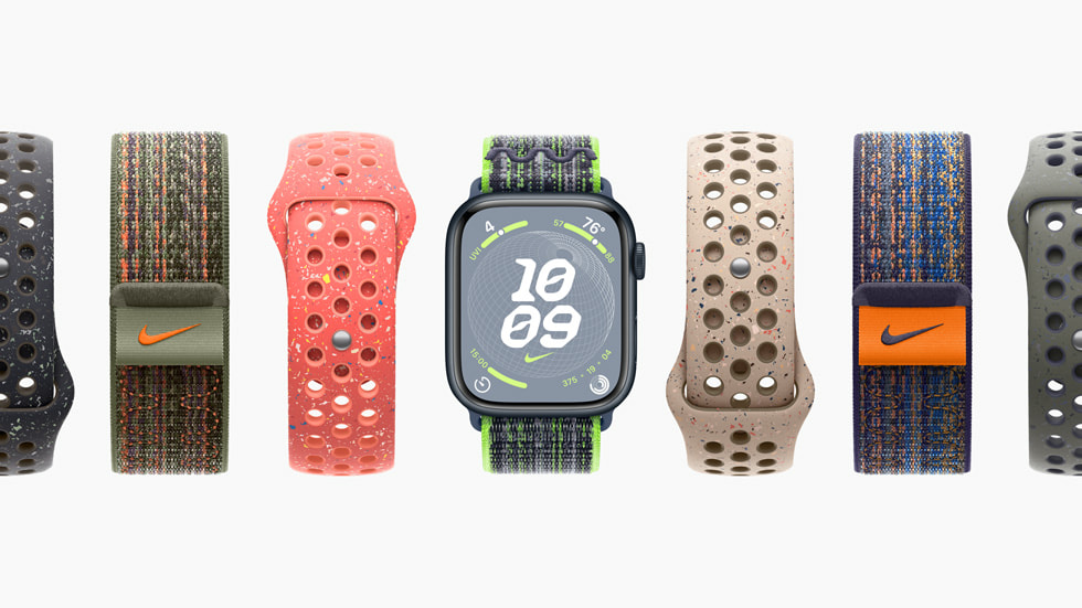 Farklı Nike Spor Loop ve Nike Spor Kordon renk düzenlerini yan yana gösteren yedi Apple Watch Series 9 aygıtı.