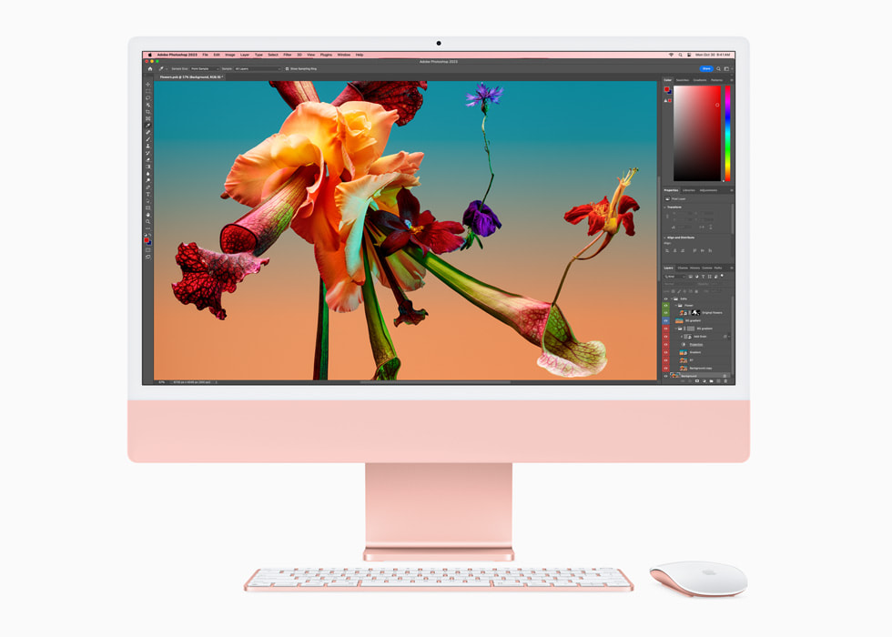 M3 çipe sahip pembe renkli yeni iMac’te Adobe Photoshop ve iMac ile uyumlu renkte klavye ve fare gösteriliyor.