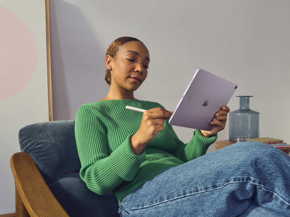 A creative in an home office setting uses Apple Pencil Pro on the new iPad Air.