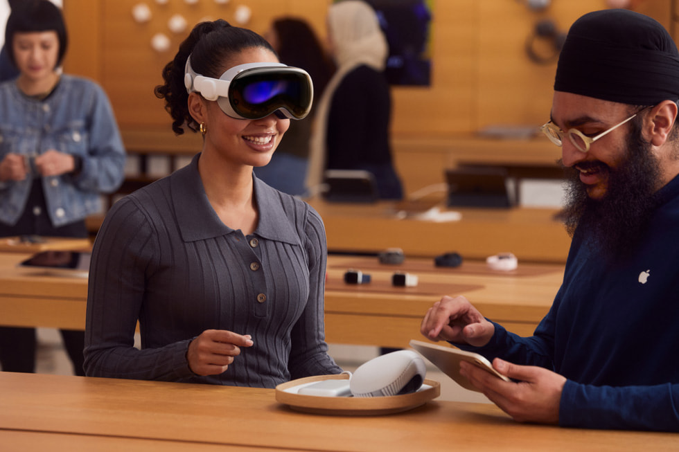 An Apple Vision Pro customer getting help from an Apple team member.
