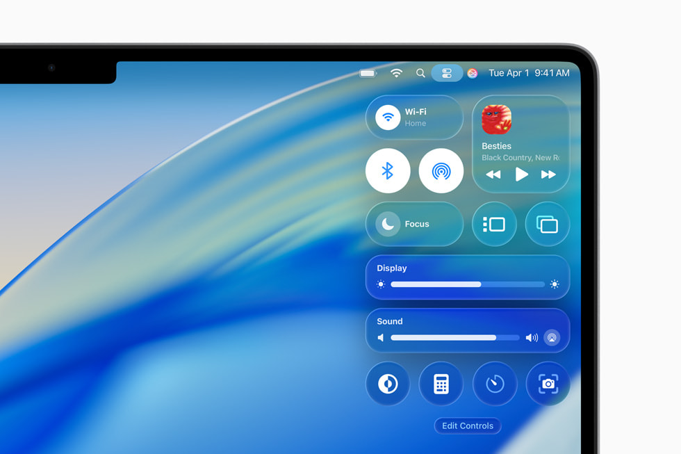 16-inch MacBook Pro shows the Control Centre with the new design in macOS Tahoe.