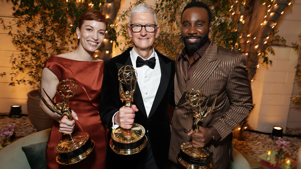 Britt Lower, Tim Cook, and Tramell Tillman pose with Emmy Award statuettes.