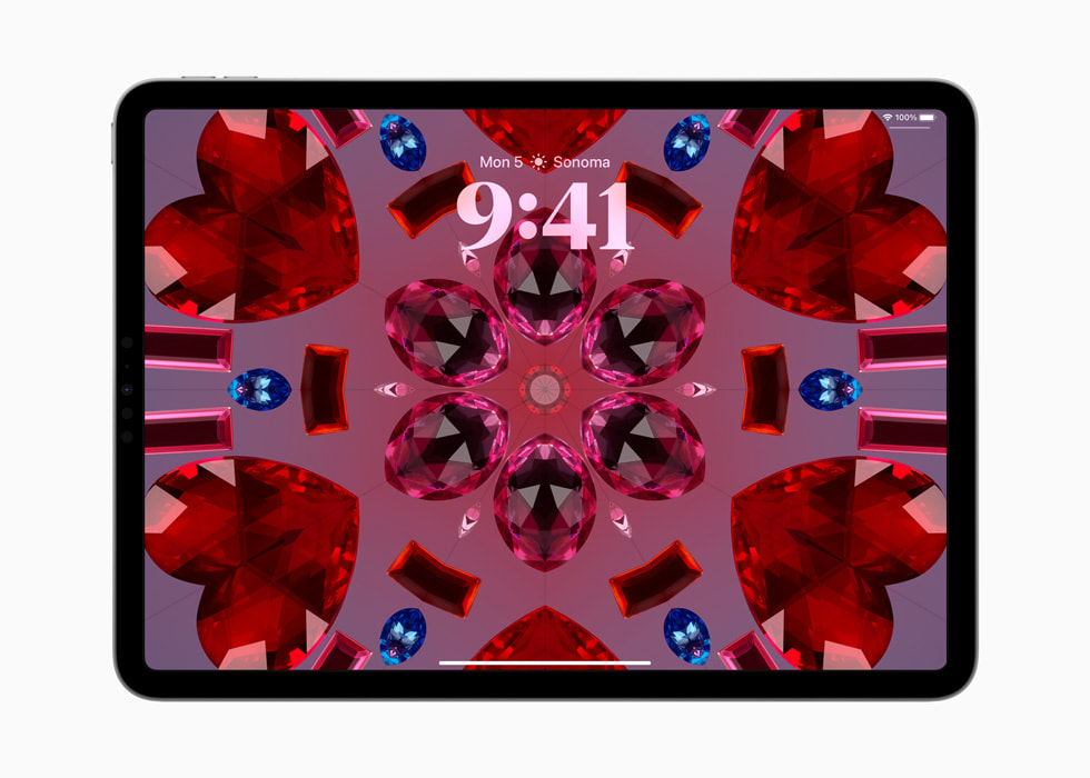 Op een iPad Pro is een caleidoscoop-achtergrond te zien.