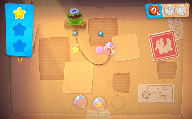 “Cut the Rope Remastered” 게임의 한 장면.