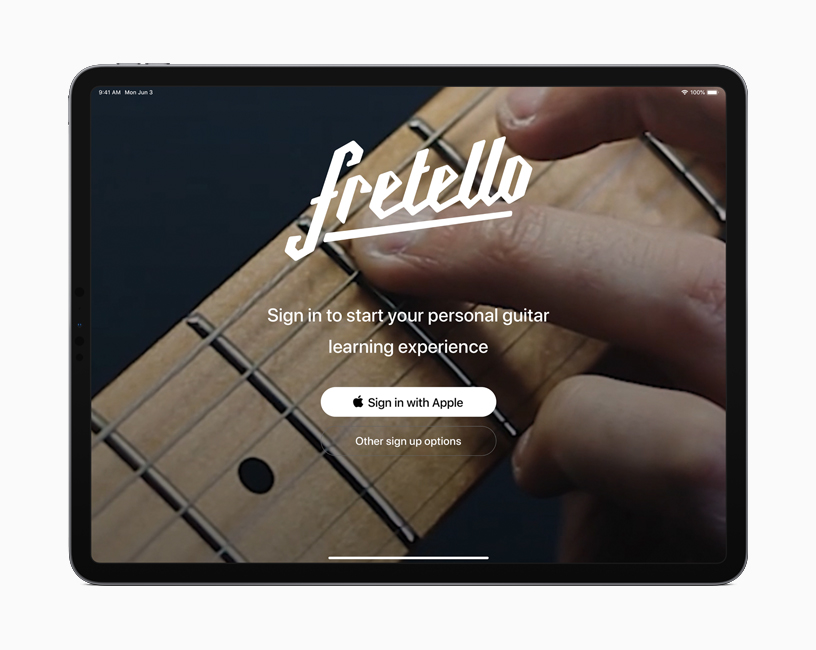 Apple ile Oturum Aç seçeneğine sahip iPadOS oturum açma ekranı.