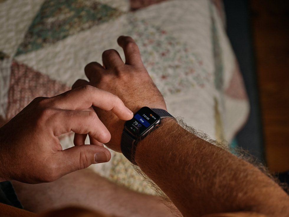 A close-up of Robert Guithues checking his Apple Watch where the Nightvision app is displayed.